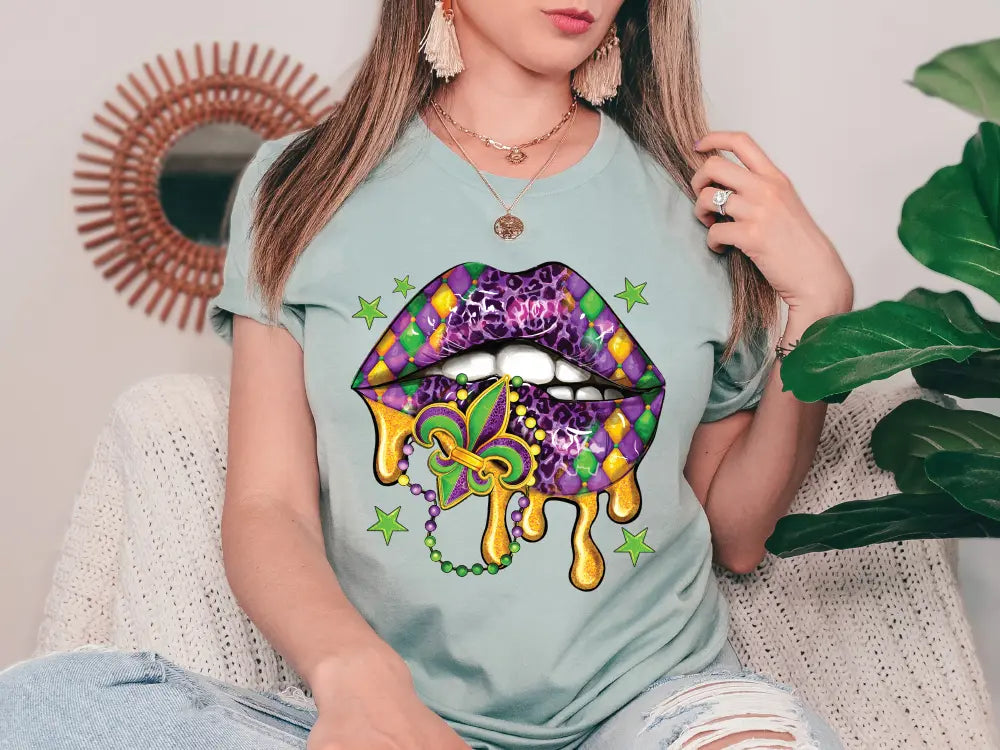 a woman sitting on a couch wearing a t - shirt with a picture of a