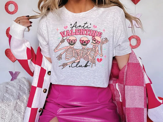 a woman in a white shirt and pink skirt