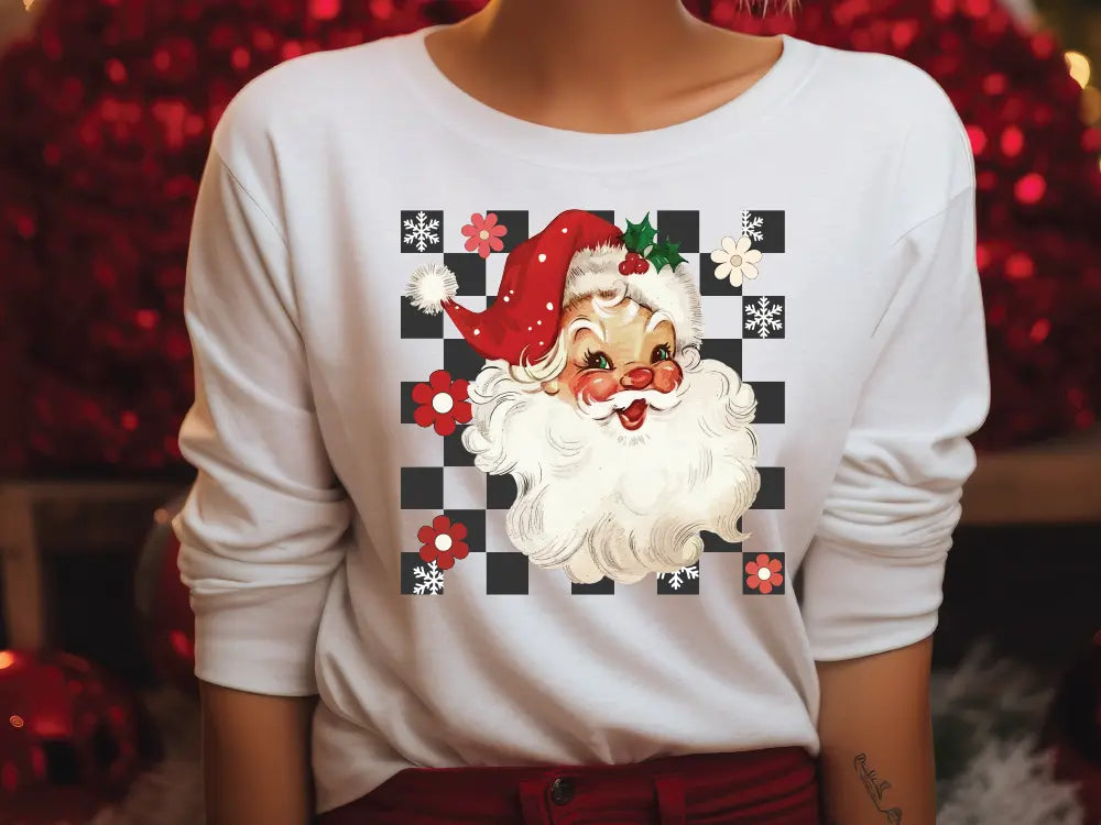 a woman wearing a santa clause shirt and red pants