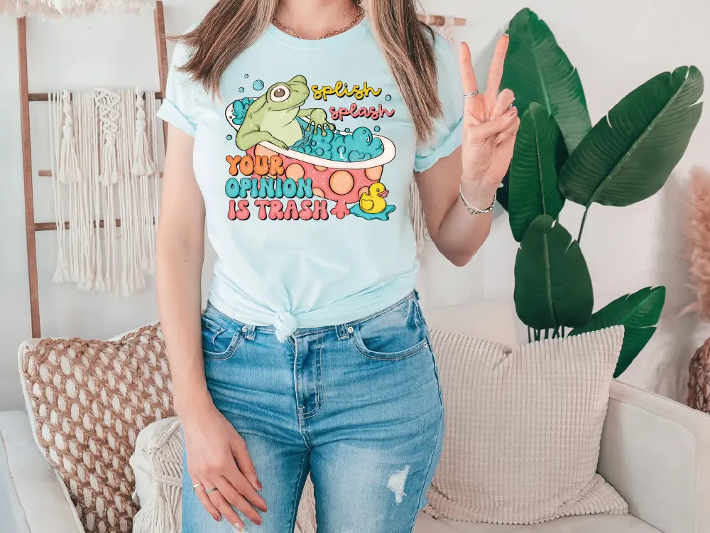 a woman standing in front of a couch holding a peace sign
