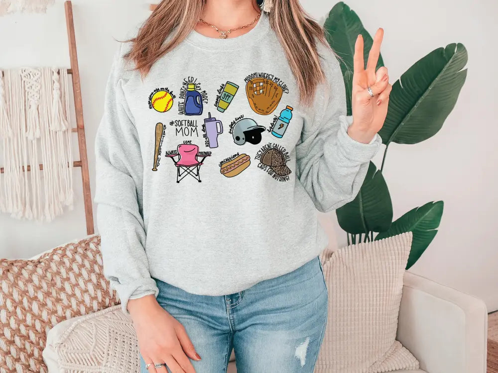a woman wearing a sweatshirt with a variety of items on it