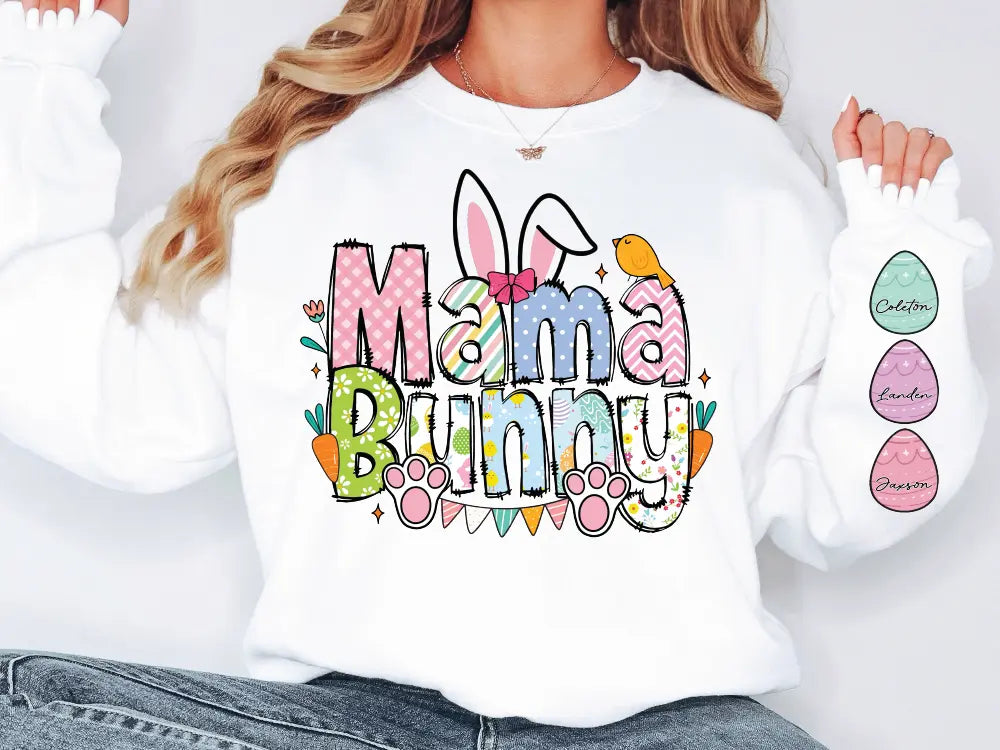 a woman wearing a white mama bunny sweatshirt