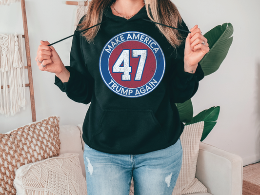 a woman wearing a black hoodie with the number 47 on it
