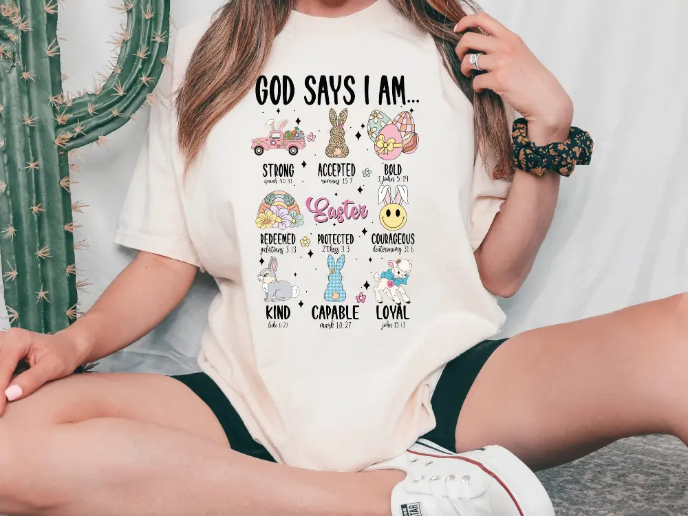 a woman sitting on the floor wearing a t - shirt