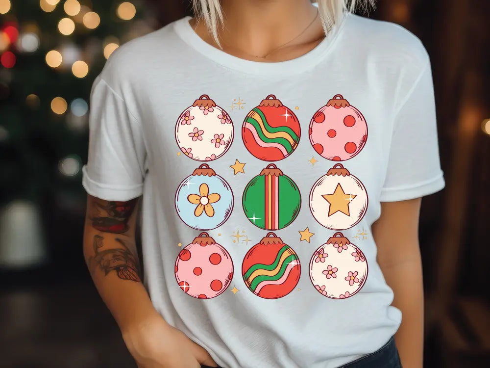 a woman wearing a t - shirt with ornaments on it