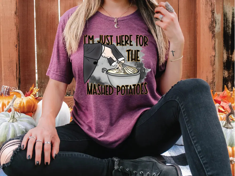 a woman wearing a t - shirt that says i'm just here for the