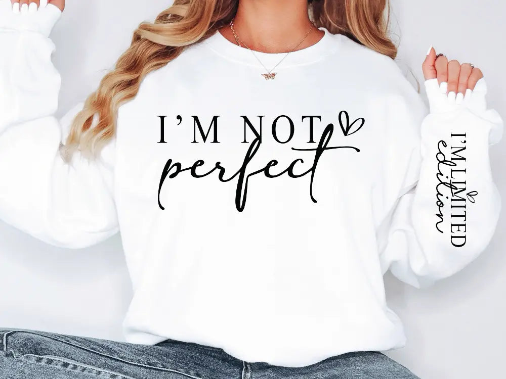 a woman wearing a white sweatshirt that says i'm not perfect