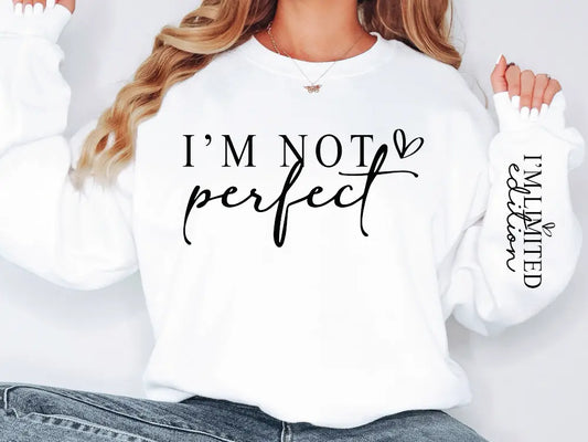 a woman wearing a white sweatshirt that says i'm not perfect