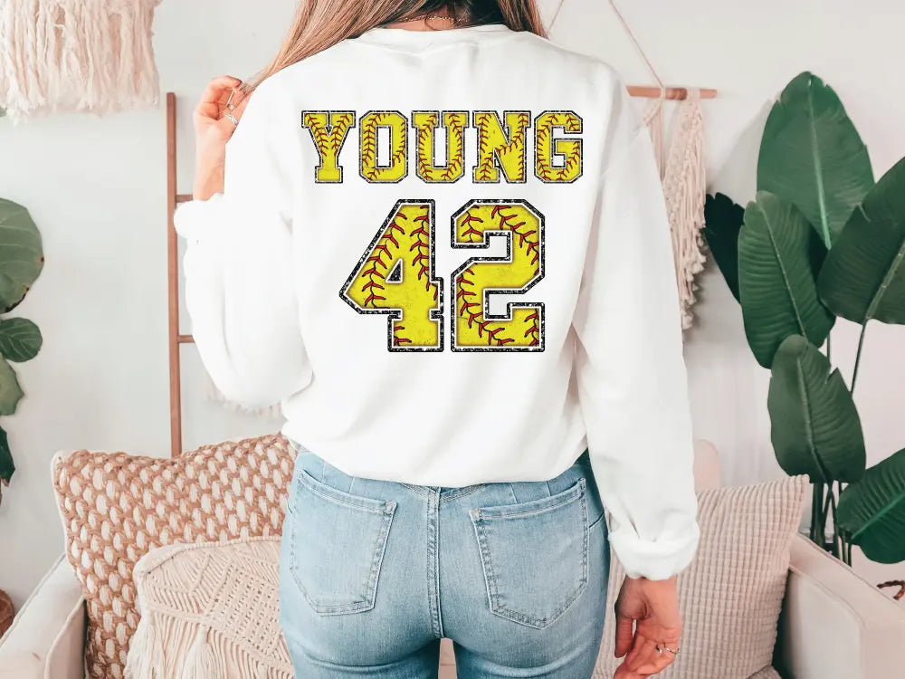a woman wearing a white sweatshirt with the number 42 printed on it