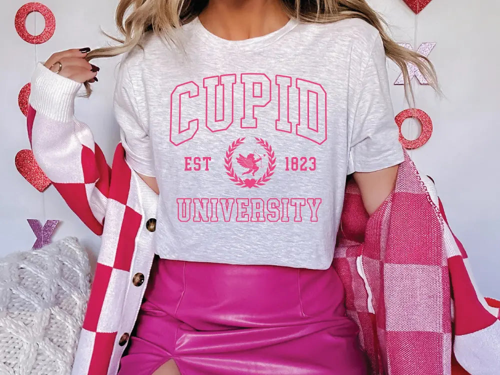 a woman in a white shirt and pink skirt