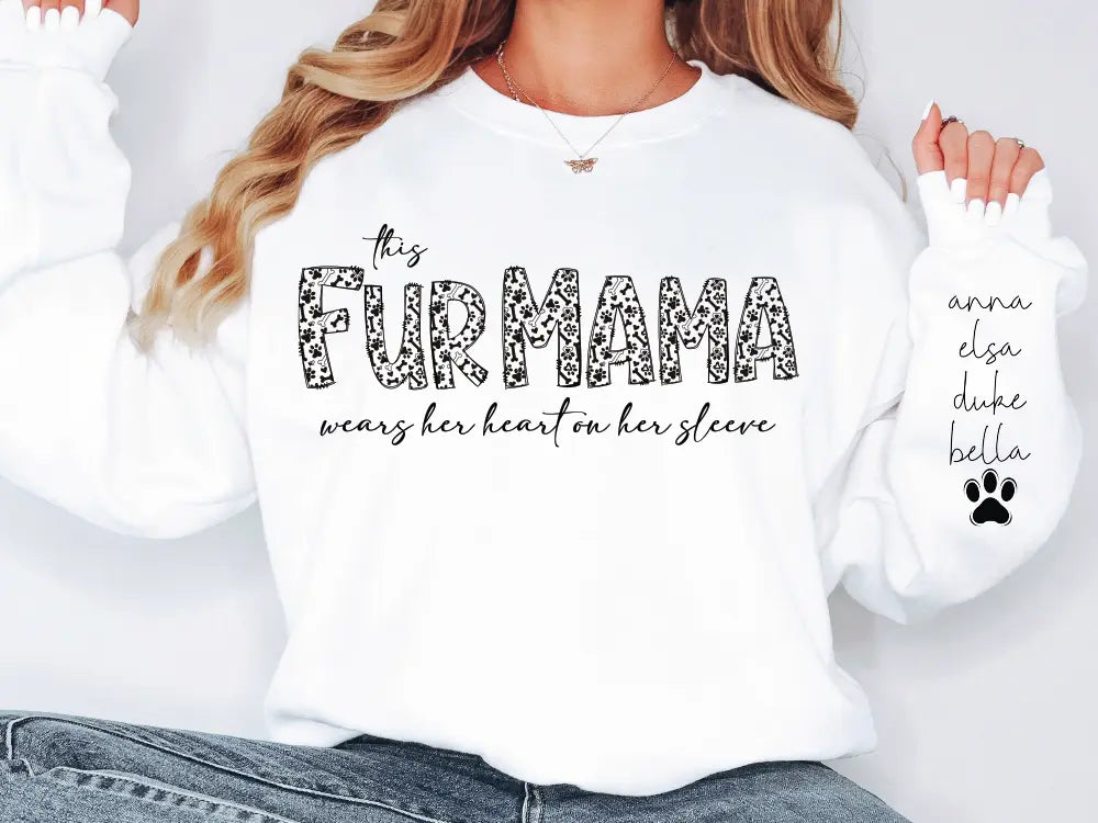 a woman wearing a white shirt that says, the fur mama