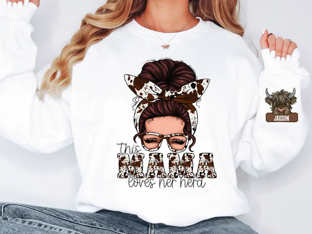 a woman wearing a white sweatshirt with a cow's head on it