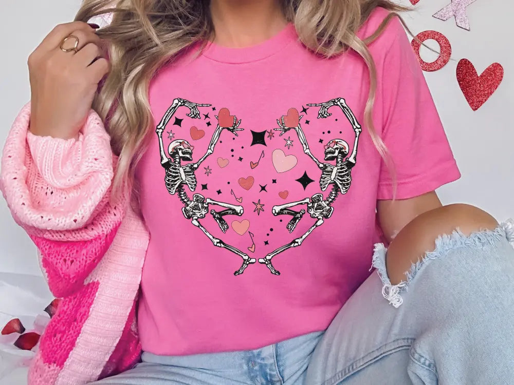 a woman wearing a pink heart shaped t - shirt