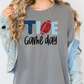 a woman wearing a t - shirt that says toe game day