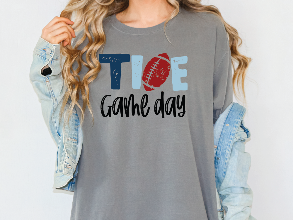 a woman wearing a t - shirt that says toe game day