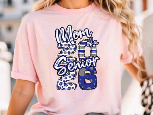 A woman wearing a pink t-shirt with a graphic design that says "Mom of a Senior 2016".