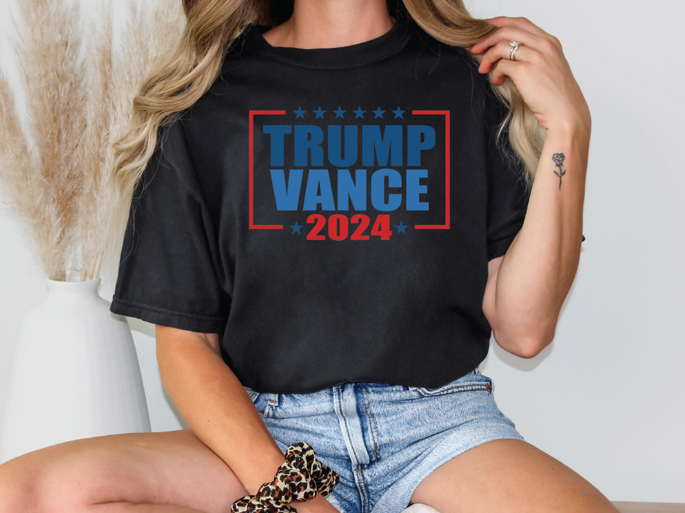 a woman wearing a trump vance t - shirt