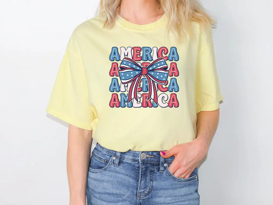 a woman wearing a yellow america tee shirt