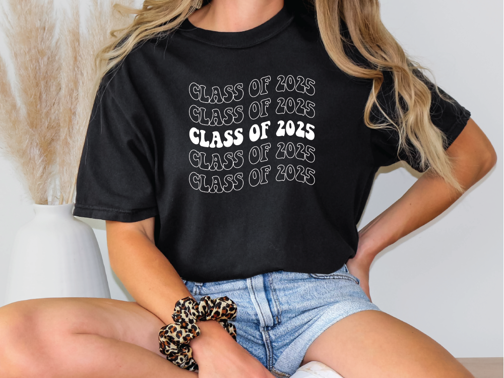 a woman wearing a class of 2012 t - shirt