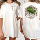 two different views of a white t-shirt with a graphic design on the back. The design features a green alligator head with the word "GATORS" written below it.