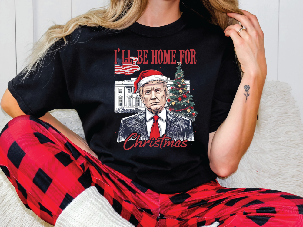 a woman wearing pajamas and a t - shirt that says i'll be home