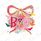 a colorful and whimsical design with the word "BOO" prominently displayed. The design includes a large pink bow, a variety of bats in different colors, and a starburst pattern. The overall composition is visually engaging and playful, with the use of bright colors and the inclusion of the word "BOO" as the central focus.