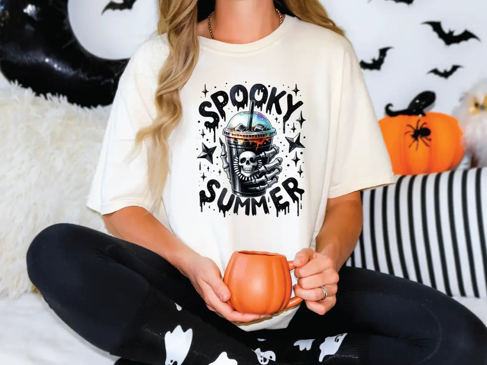 a woman sitting on a bed holding a pumpkin