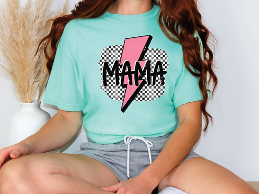 a woman sitting on a chair wearing a t - shirt with a lightning bolt on