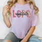 a woman sitting on the floor wearing a t - shirt with the word lops