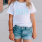a little girl wearing a t - shirt that says salty