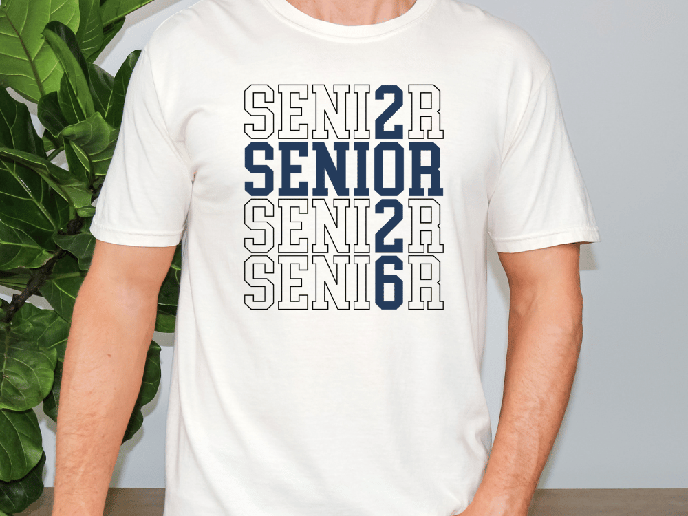 A white t-shirt with the text "SENIOR SENIOR SENIOR SENIOR SENIOR" printed on it in blue and white.