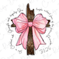 a cross with a pink bow on it