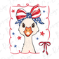 a white bird with a red, white and blue bow