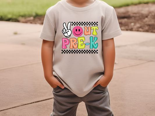 a young boy wearing a t - shirt with a peace sign on it