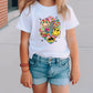 a little girl wearing a white shirt and denim shorts