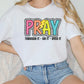 a woman sitting on a couch wearing a t - shirt that says pray through it