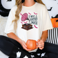 a woman sitting on a bed holding a mug