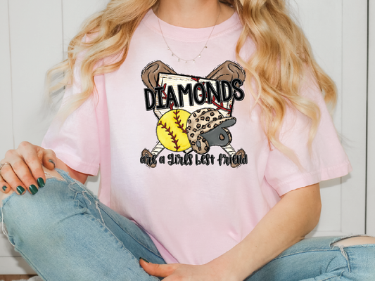 a woman sitting on the floor wearing a pink diamond t - shirt