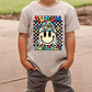 a young boy wearing a autism awareness shirt