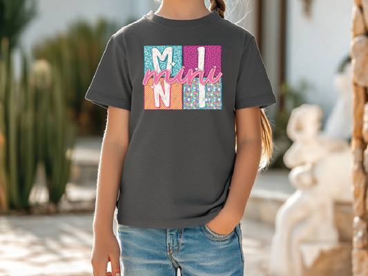 a little girl wearing a t - shirt that says mellie nine