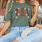 a woman sitting on a bed wearing a t - shirt that says fall