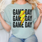 a woman wearing a game day shirt with a lightning bolt