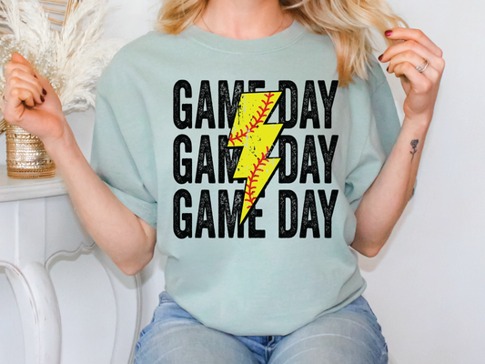 a woman wearing a game day shirt with a lightning bolt