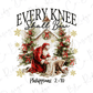 a Christmas scene with a Santa Claus figure kneeling in front of a baby Jesus in a manger, surrounded by Christmas trees and wreaths. The text "EVERY KNEEE Shall Bow" is prominently displayed above the Santa Claus figure, and "Philippians 2:10" is written below the image.