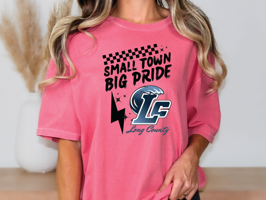 a woman wearing a pink shirt that says small town big pride