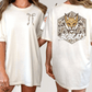 two different views of a white t-shirt with a graphic design on the back. The design features a fox's face and the word "BOBCATS" written below it.