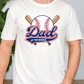 A white t-shirt with a graphic design featuring a baseball and the text "DAD of the ROOKIE" printed on it.