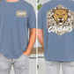 a man wearing a blue t-shirt with a cougar graphic and the word "Cougars" printed on it.