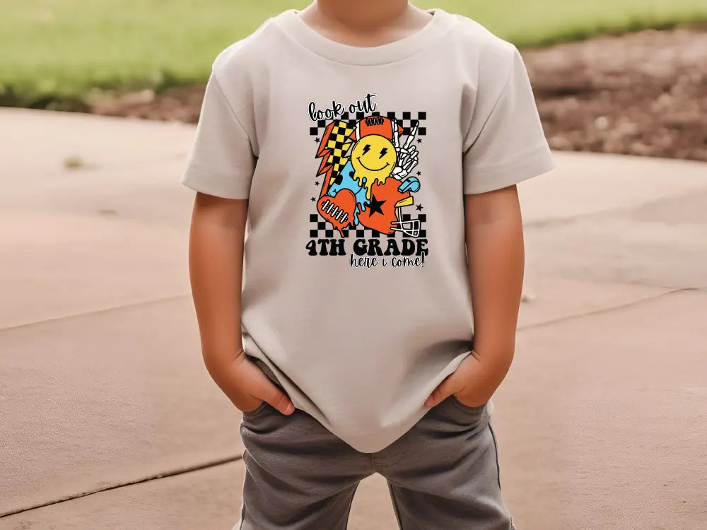 a young boy wearing a t - shirt with a cartoon character on it