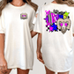 A white t-shirt with a graphic design on the back, featuring a stylized image of a ram with a checkered pattern and colorful elements.